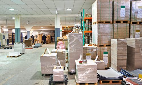 Warehouse, packaging and manufacturing with distribution or supply chain for wholesale, delivery and supplier. Logistics, storage and factory with machines or equipment  in industrial storehouse.